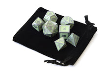 Load image into Gallery viewer, Enchanted Green Metal Dice Set in the light with dice pouch| 7 piece