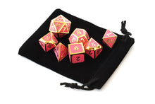 Load image into Gallery viewer, Enchanted Red Metal Dice Set in the light with dice pouch | 7 piece