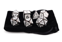 Load image into Gallery viewer, Oath of Devotion - white and black enamel metal dice set with Italic Font on top of a Black Dice Pouch