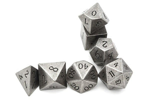 Tarnished Silver Metal Dice Set with Engraved Font 7 Pieces Stacked up